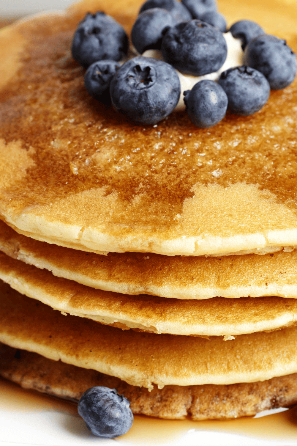 Easy Bisquick Pancake Recipe: Ultimate Apple Cinnamon large stack of pancakes with blueberries close up