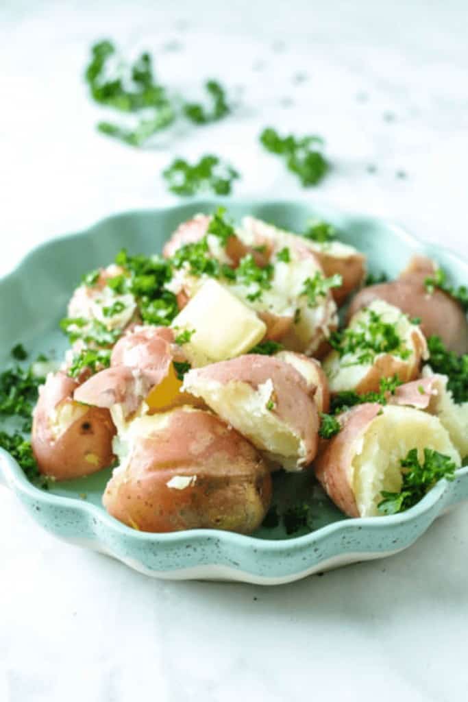 8 Minute Instant Pot Baby Potatoes with Parsley & Butter. So simple to make and ready for a warm & buttery side dish for any family dinner. Super Simple side dish delicious, made hands free in the Instant Pot. 