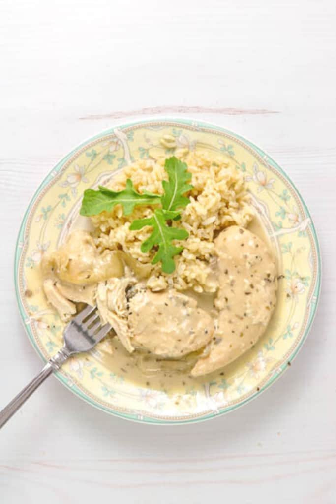 Crock-Pot Garlic Herb Chicken Tenders Pantry Dinner on green and yellow plate with fork