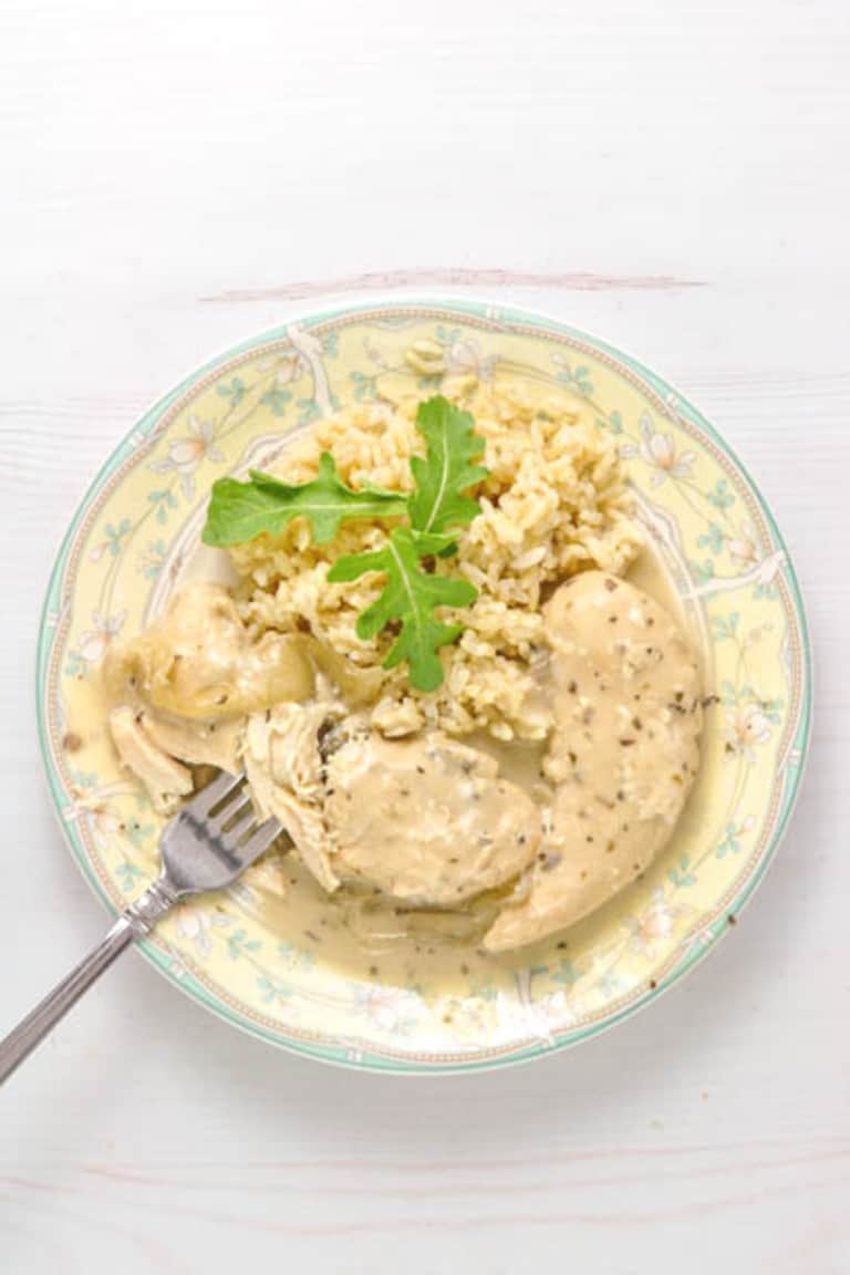 Crock-Pot Garlic Herb Chicken Tenders Pantry Dinner on green and yellow plate with fork