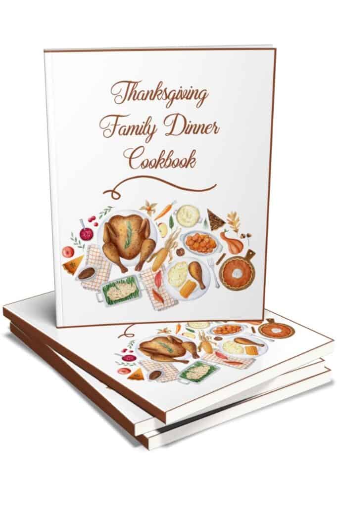 Thanksgiving dinner cooke book one facing and 2 laying flat underneedth.