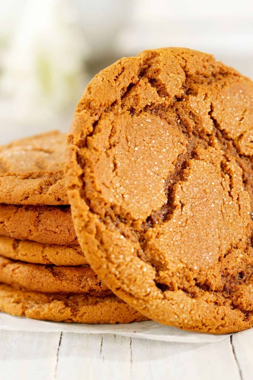 5 ginger snap cookies stacked and on leaning upright.