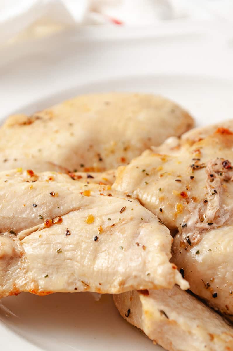 Tender Crispy Super Easy Air Fryer Chicken Breast 8 chicken on a white plate.
