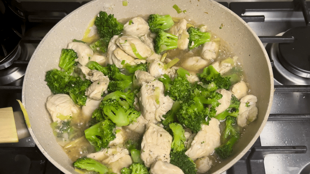chicken and broccoli in a saucepan with the sauce findished.