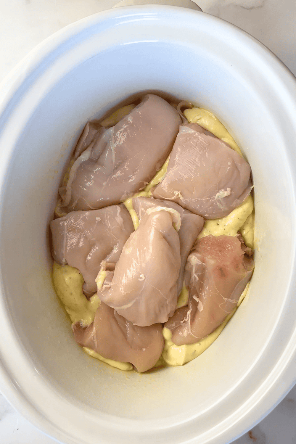 6 half chicken breasts in a crockpot with dry ranch dressing mix with cream of chicken soup.