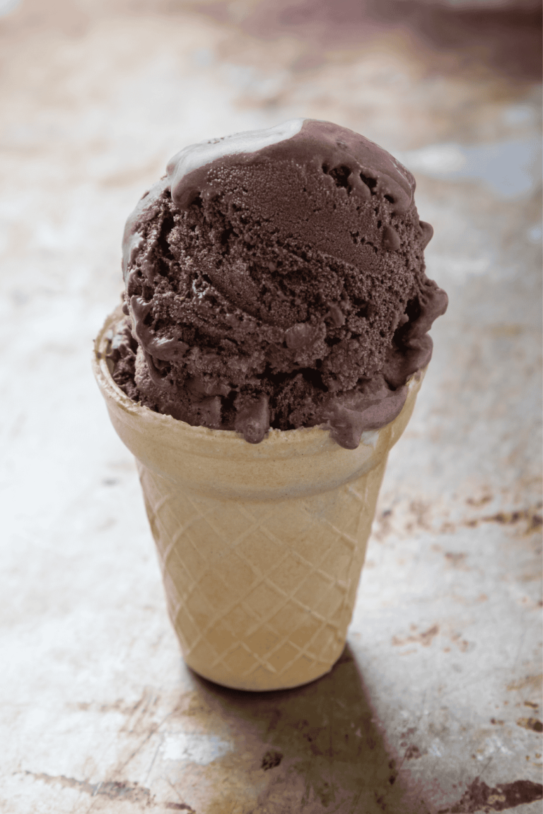Ninja Creami Chocolate Ice Cream-Special Dark Cocoa one scoop on a wafer cone on a counter.