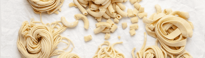 6 different pasta on white parchment