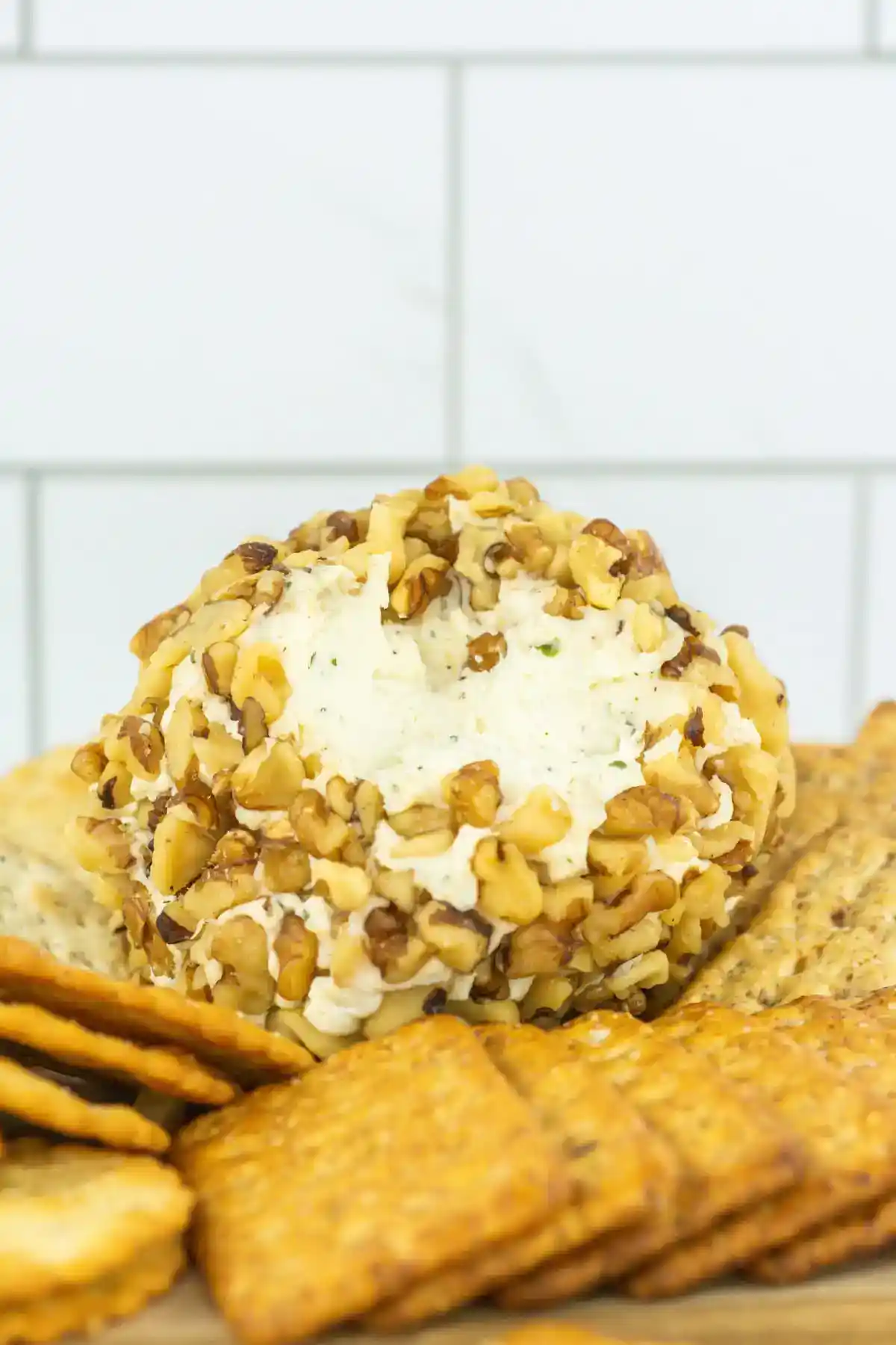 Bring this 3 Ingredient Cheese Ball Recipe to your next get together, game night, or appetizer party. It always tastes delicious and can be served with so many different things to dip in the easy cheese ball recipe.