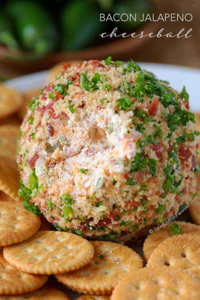 Bacon JalapeΓ±o Cheese Ball rolled in fresh herbs and bacon bits, served with round crackers β a spicy and savory option for cheese ball recipes easy and flavorful appetizers for party.