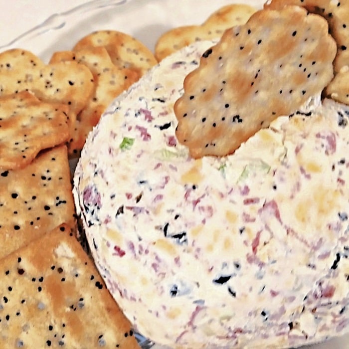 Dried Beef Cream Cheese Ball surrounded by seeded crackersβone of the easiest holiday cheese balls for savory party snacking.