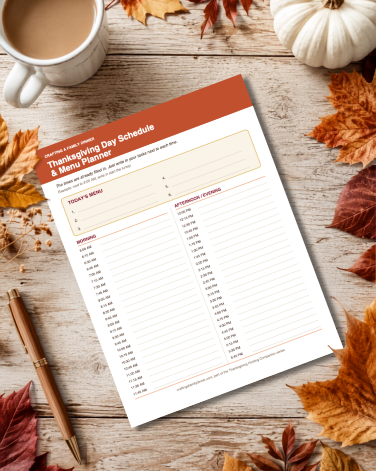 fall background image with the thanksgiving schedule PDF on the wooden table.