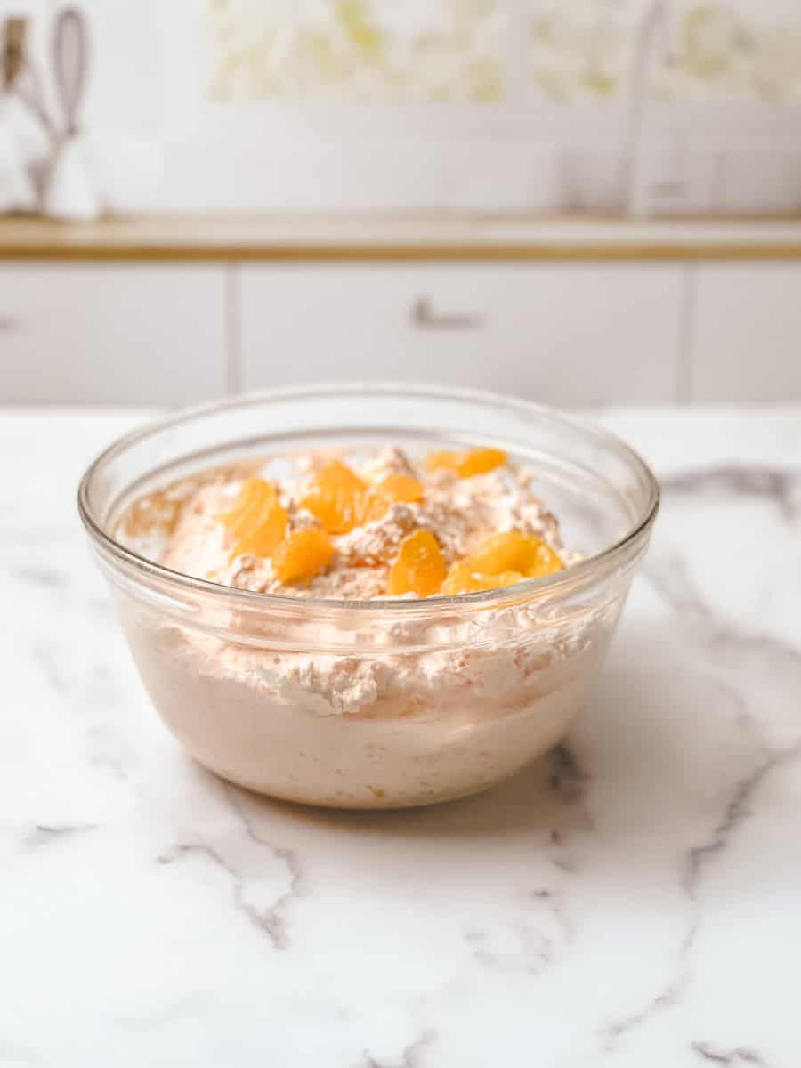 Close up of orange fluff jello salad recipe with mandarin orange fluff and cottage cheese